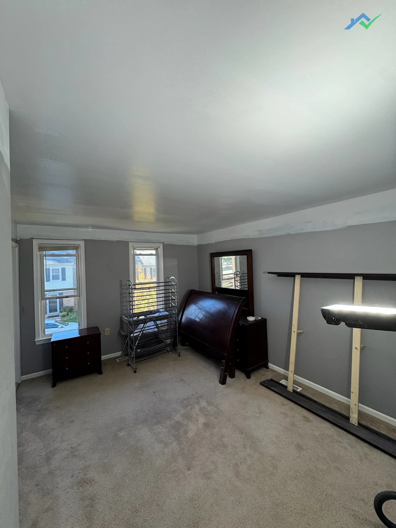 The finished Burke bedroom ceiling after a full replacement, two coats of primer and two coats of ceiling paint.