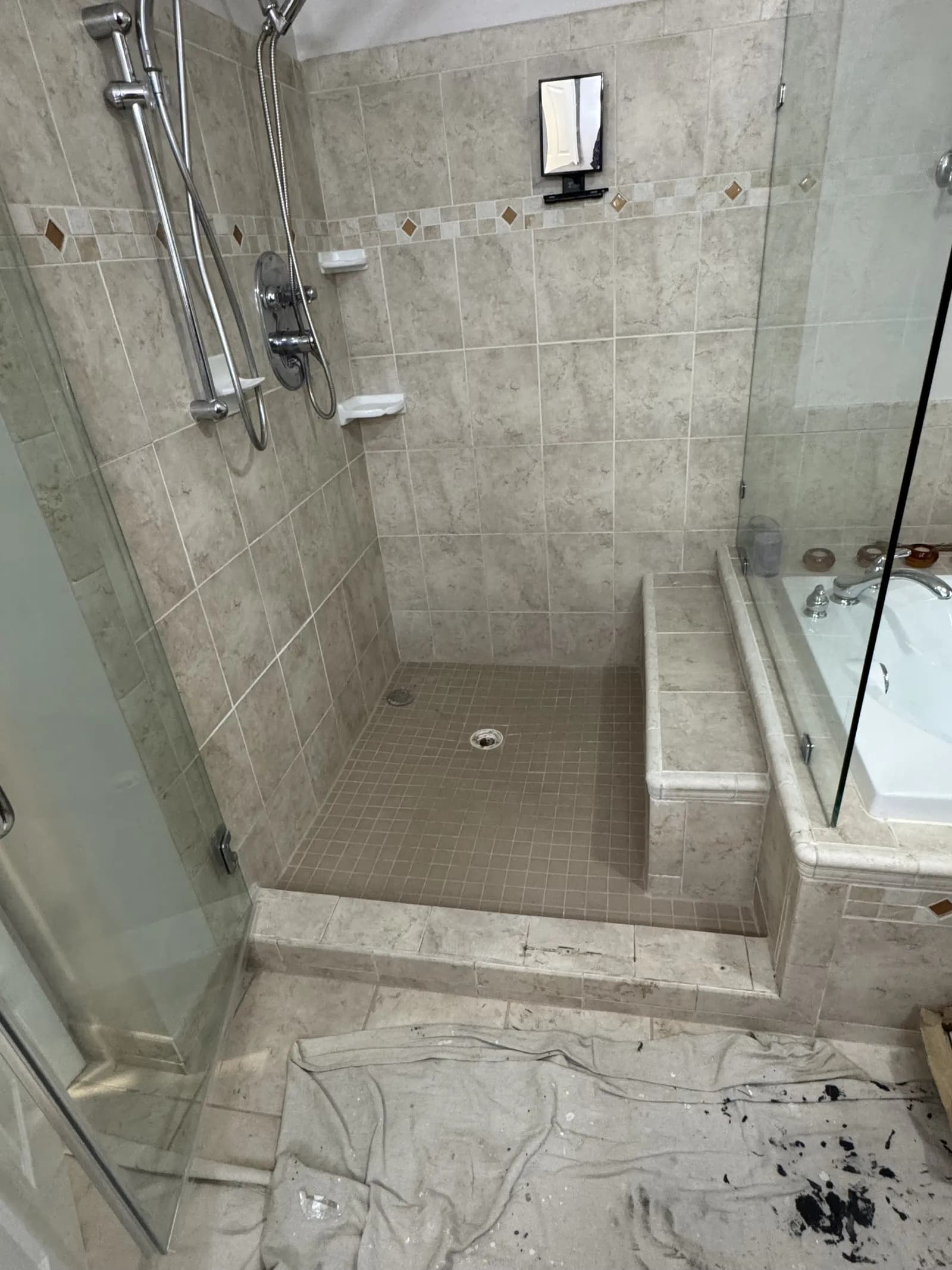 The upstairs walk-in shower in the Fairfax Station home as found — the suspected source of the kitchen ceiling leak.