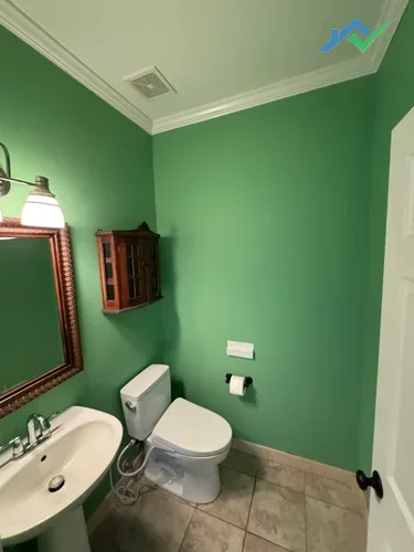 Guest bathroom in Purcellville, VA with new ceiling paint, updated trim, and fresh wall color after full refresh.