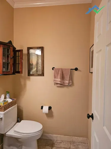 Wider view of the Purcellville, VA guest bathroom prior to the drywall patch and room refresh.